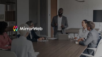 A compliance technology leader presents the business case for RegTech investment to a group of financial services executives in a modern boardroom.