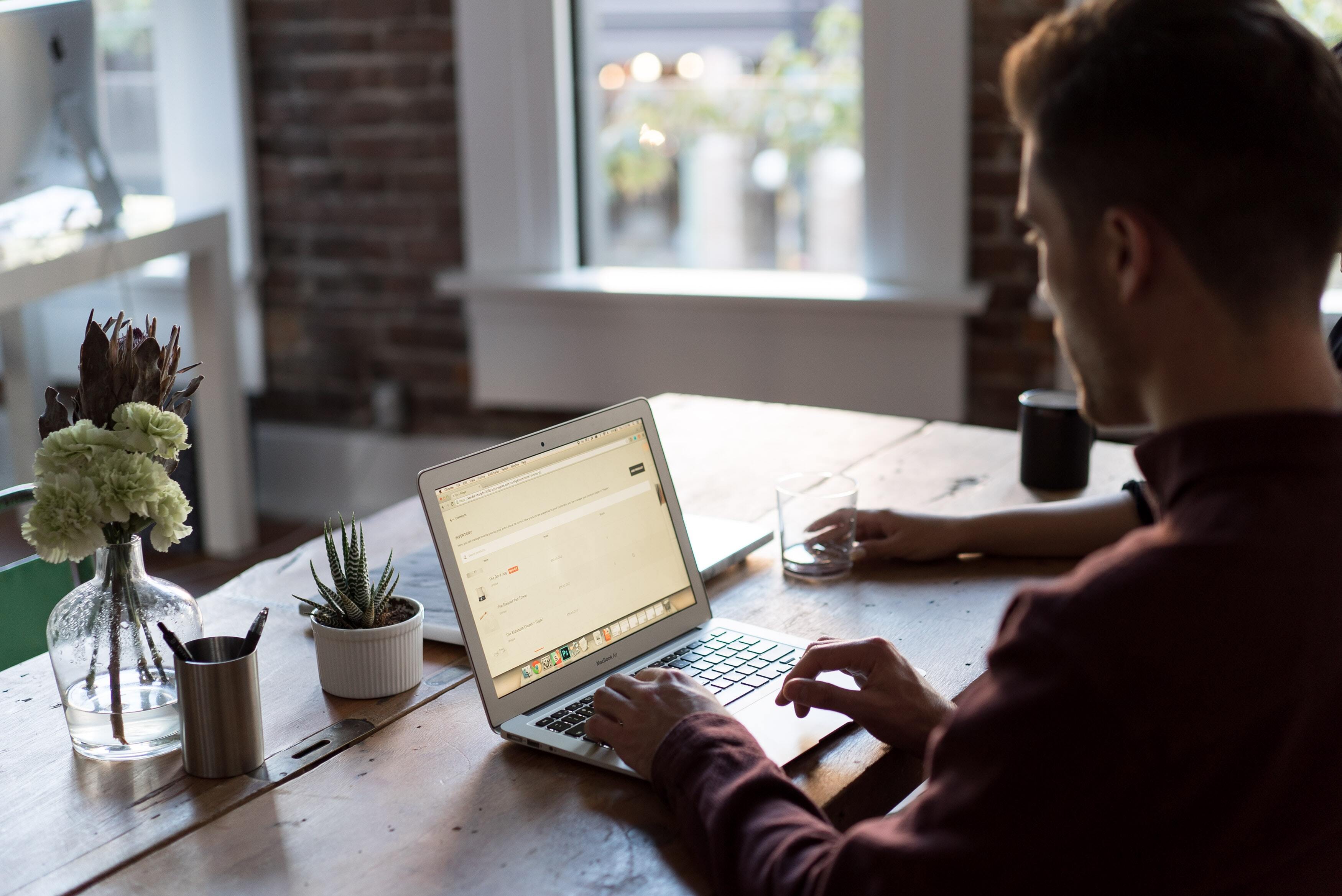 Person working from home on their kitchen counter