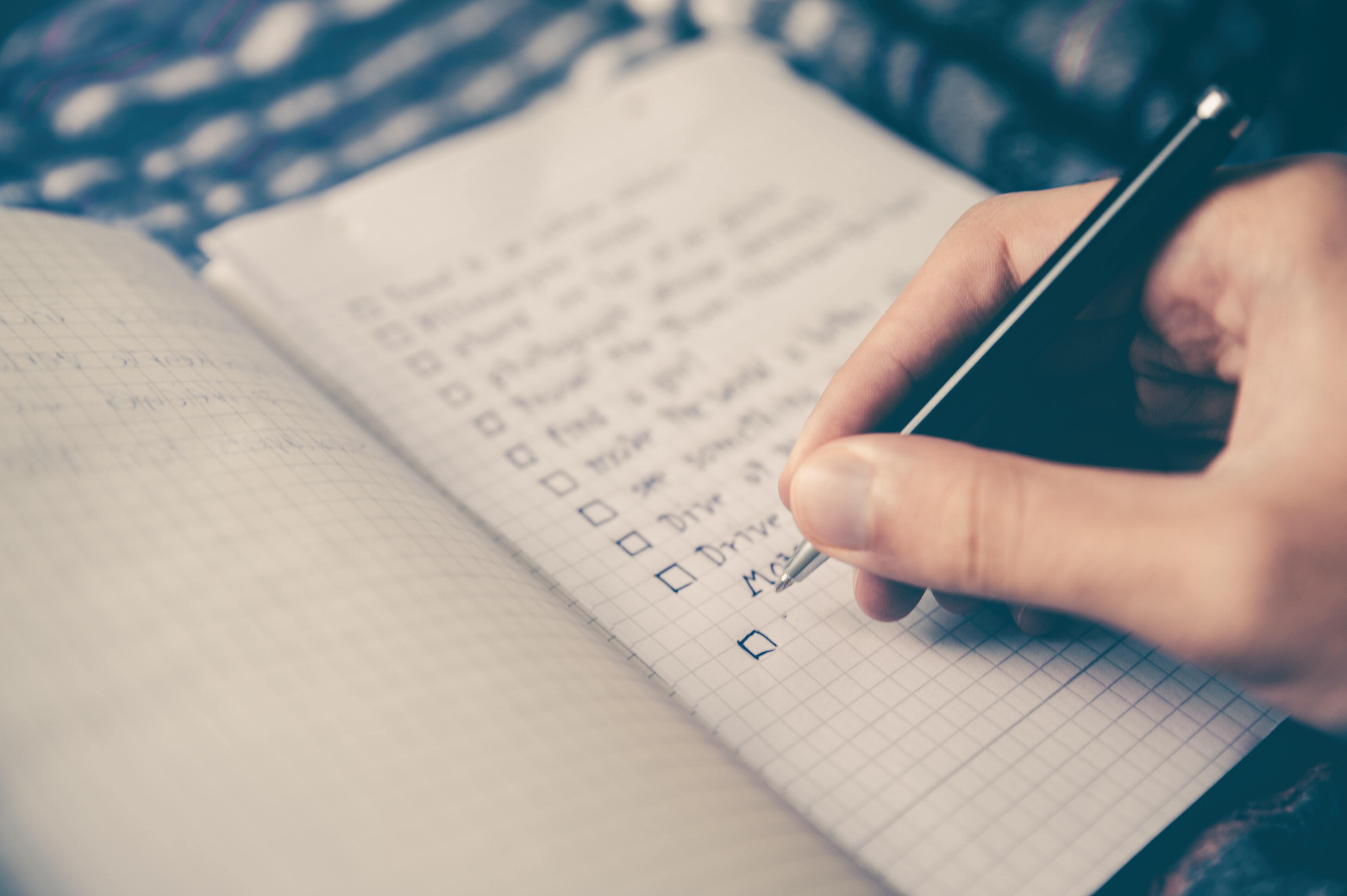 Person filling out a checklist