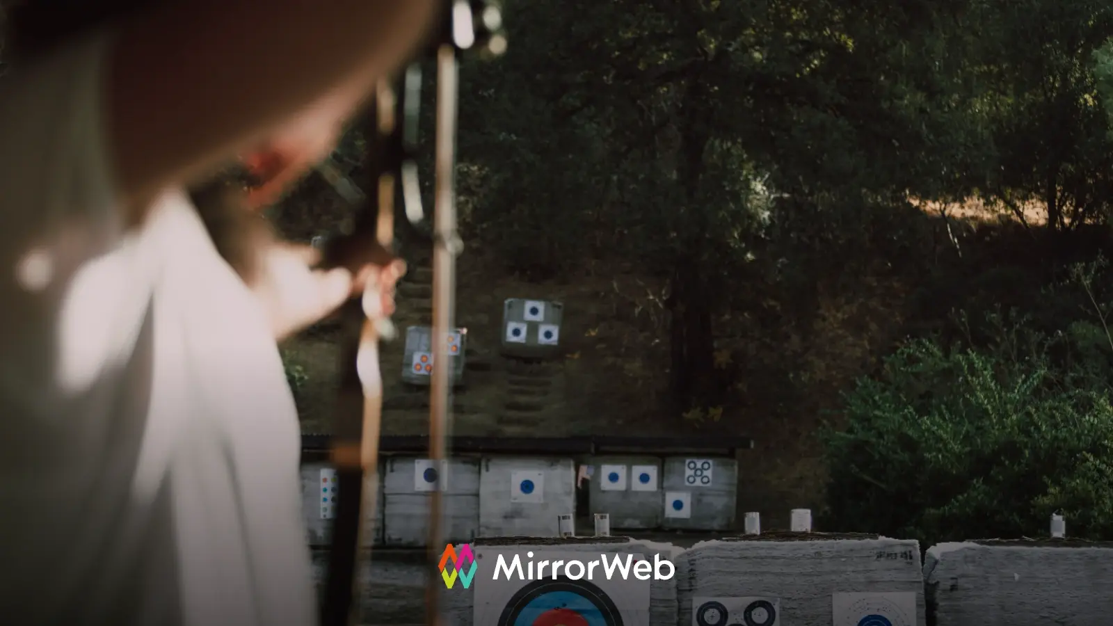 Archer aiming at multiple targets, illustrating the importance of accuracy in digital communications compliance